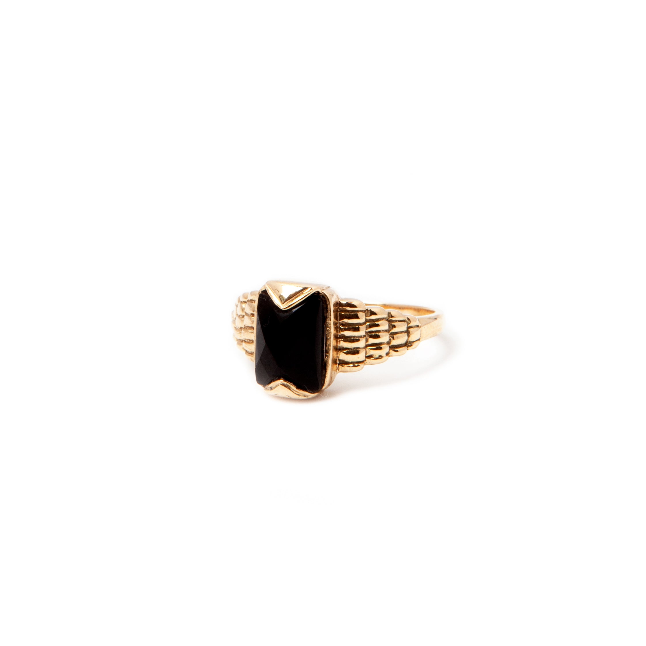 Gold ring with hot sale black stone meaning